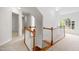 Bright hallway with hardwood stairs, carpet, and natural light from the window at 104 S Crabtree Knl, Chapel Hill, NC 27514