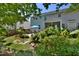 A spacious backyard includes a patio, seating area, lush landscaping, and stone pathway at 1056 Evening Shade Ave, Rolesville, NC 27571