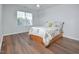 Bedroom with wood flooring, a ceiling fan, and a window with blinds at 1056 Evening Shade Ave, Rolesville, NC 27571
