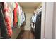 Walk-in closet featuring built-in shelving and ample storage space for clothes and accessories at 1056 Evening Shade Ave, Rolesville, NC 27571
