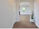 A view of the home's entryway with a door leading into a living space and a potted plant at 1056 Evening Shade Ave, Rolesville, NC 27571
