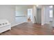 Upstairs hallway with wood floors, white trim, and natural light at 1056 Evening Shade Ave, Rolesville, NC 27571