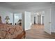Spacious main bedroom featuring tray ceilings, wood floors, and an attached sitting room/office at 1056 Evening Shade Ave, Rolesville, NC 27571
