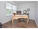 Cozy home office with wood floors, large window, and traditional furnishings at 1056 Evening Shade Ave, Rolesville, NC 27571