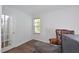 Bright office space with a classic leather chair, modern desk, and a window at 1056 Evening Shade Ave, Rolesville, NC 27571