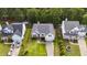Beautiful aerial view showcases the home's curb appeal and landscaped front yard surrounded by other manicured homes at 107 Governors House Dr, Morrisville, NC 27560