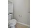 Powder room featuring tile flooring and a storage cabinet above the toilet at 107 Governors House Dr, Morrisville, NC 27560