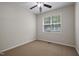 Bedroom featuring carpet floors, a ceiling fan, and a window at 107 Governors House Dr, Morrisville, NC 27560