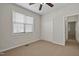 Bedroom featuring carpet floors, a ceiling fan, a closet, and a window at 107 Governors House Dr, Morrisville, NC 27560