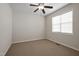 Bedroom featuring carpet floors, a ceiling fan, and a window at 107 Governors House Dr, Morrisville, NC 27560