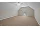 Bright bonus room with neutral carpet, a window, and sloped ceilings, ideal for a home office or play area at 107 Governors House Dr, Morrisville, NC 27560
