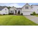 Charming home with manicured lawn, two-car garage, and beautiful landscaping at 107 Governors House Dr, Morrisville, NC 27560