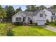 Charming home with manicured lawn, two-car garage, and landscaping at 107 Governors House Dr, Morrisville, NC 27560
