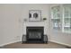 Close up of the fireplace with decorative items on the mantle at 107 Governors House Dr, Morrisville, NC 27560
