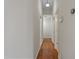 Hallway featuring sleek hardwood floors, neutral walls, and recessed lighting provides a clean and open feel at 107 Governors House Dr, Morrisville, NC 27560