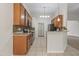 Open kitchen featuring tile floors, backsplash, and modern appliances at 107 Governors House Dr, Morrisville, NC 27560