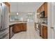 Modern kitchen with stainless steel appliances and wood cabinets at 107 Governors House Dr, Morrisville, NC 27560