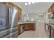 Spacious kitchen with modern stainless steel appliances and wood cabinets at 107 Governors House Dr, Morrisville, NC 27560