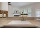 Bright kitchen with a stainless steel faucet, undermount sink, granite countertop, and decorative mosaic backsplash at 107 Governors House Dr, Morrisville, NC 27560