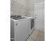 Laundry room features Whirlpool washer, Samsung dryer, and tile flooring at 107 Governors House Dr, Morrisville, NC 27560