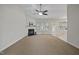 Bright living room featuring a cozy fireplace and neutral carpet at 107 Governors House Dr, Morrisville, NC 27560