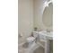 Cozy powder room featuring a pedestal sink with decorative towel and a comfort height toilet at 107 Governors House Dr, Morrisville, NC 27560
