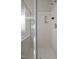 Bathroom shower featuring glass doors and a white, molded shower at 107 Governors House Dr, Morrisville, NC 27560