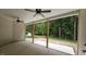 The home's back porch offers a relaxing view of the lush greenery surrounding the property at 109 Drew St, Louisburg, NC 27549