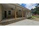 Relax on the back porch with ceiling fans, perfect for enjoying the outdoors at 109 Drew St, Louisburg, NC 27549