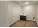 Functional laundry room area with a sink, cabinet, and available washer-dryer hookups at 109 Drew St, Louisburg, NC 27549