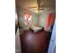 Bedroom featuring a ceiling fan and a window with red curtains at 109 N 2Nd St, Sanford, NC 27330