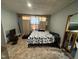 Bedroom featuring vinyl flooring, and natural light from a window at 109 N 2Nd St, Sanford, NC 27330