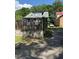 Rustic home with a mix of vintage charm and outdoor potential, set against a lush green backdrop at 109 N 2Nd St, Sanford, NC 27330