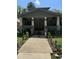 Charming exterior view of a two-story home with a front porch and walkway at 109 N 2Nd St, Sanford, NC 27330