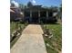 Charming home with a large front yard and inviting walkway at 109 N 2Nd St, Sanford, NC 27330