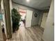 Hallway featuring wood-look flooring and a view into an adjacent room at 109 N 2Nd St, Sanford, NC 27330