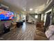 Bright living room featuring hardwood floors, a fireplace, and comfortable seating at 109 N 2Nd St, Sanford, NC 27330