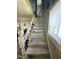 Staircase leading to the upper level of the house with worn paint at 109 N 2Nd St, Sanford, NC 27330