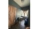 The home's sun room includes a table, 2 chairs, and natural light at 109 N 2Nd St, Sanford, NC 27330