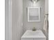 Powder room with a white vanity, a mirror, and neutral decor at 113 Feezor Ct, Clayton, NC 27527