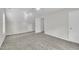 Spacious bedroom featuring neutral paint, plush carpet, ceiling fan, and ample natural light at 113 Feezor Ct, Clayton, NC 27527