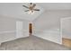 Spacious carpeted bedroom with ceiling fan and vaulted ceiling for comfortable living at 113 Feezor Ct, Clayton, NC 27527