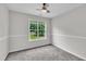 Bright, carpeted bedroom featuring natural light and neutral walls for a relaxing space at 113 Feezor Ct, Clayton, NC 27527