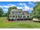 Charming two-story home with a welcoming front porch and well-manicured lawn at 113 Feezor Ct, Clayton, NC 27527