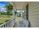 Relaxing front porch featuring a comfortable wicker bench and a view of the neighborhood at 113 Feezor Ct, Clayton, NC 27527