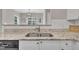 Kitchen area with stainless steel appliances and white cabinets and granite countertops at 113 Feezor Ct, Clayton, NC 27527