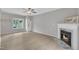Spacious living room showcasing a fireplace, hardwood floors, and a large window at 113 Feezor Ct, Clayton, NC 27527