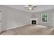 Inviting living room with a cozy fireplace and abundant natural light at 113 Feezor Ct, Clayton, NC 27527