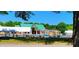 Community pool area featuring a large pool with splash zone, lounge chairs, and shaded picnic areas at 113 Feezor Ct, Clayton, NC 27527