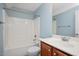 Full bathroom with cherry vanity, tub and shower combination, and chrome fixtures at 120 Tanager Farms Dr, Youngsville, NC 27596